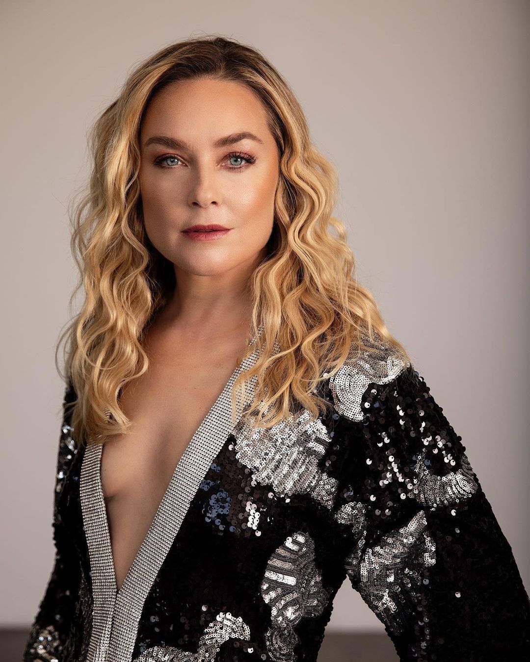 Elisabeth Röhm in a plunging black and silver sequin jacket with crystal trim, a close portrait for Jejune Magazine, styled by Quentin Fears