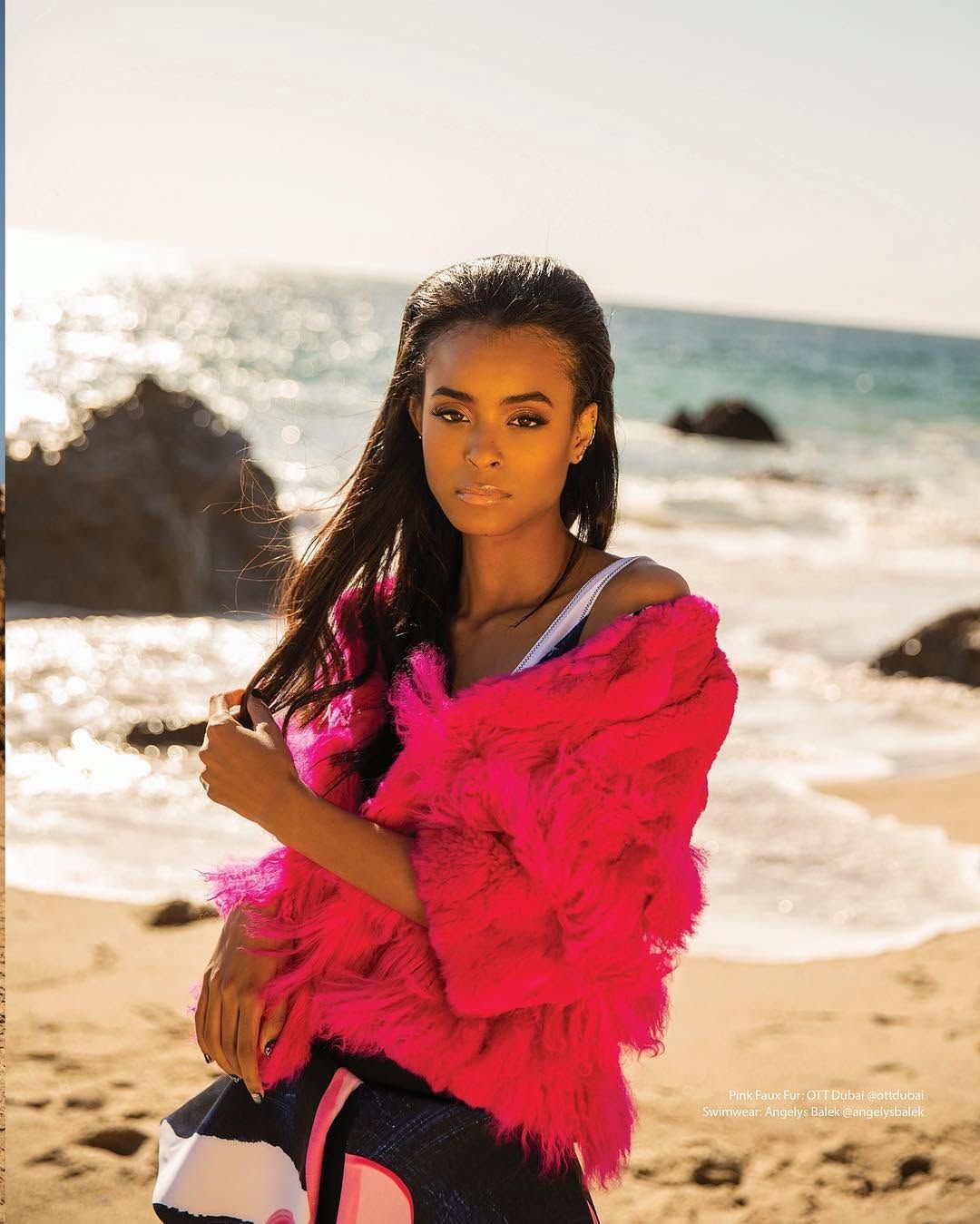 Nala Wayans in a hot pink faux fur jacket at the shoreline for New Ridge in Sheen Magazine, styled by Quentin Fears