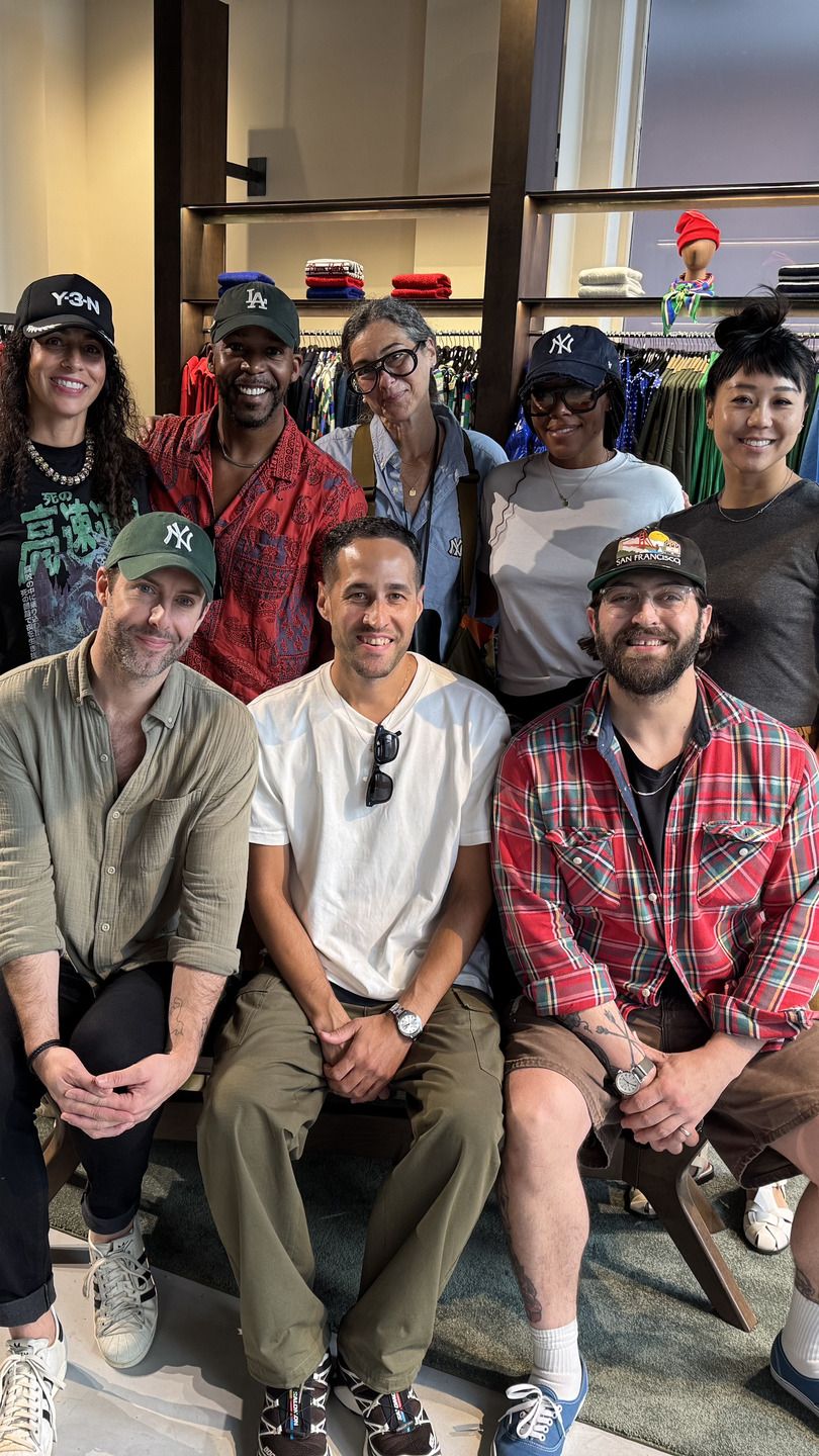 Quentin Fears with the styling and visual merchandising team on the sales floor of the NYC pop-up shop